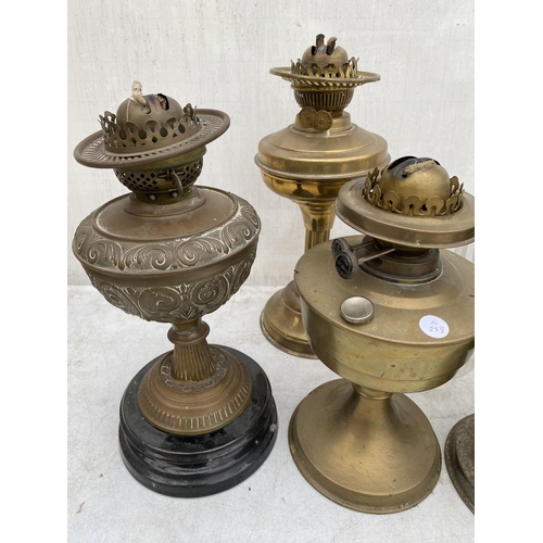 1353 - AN ASSORTMENT OF OIL LAMPS AND OIL LAMP PARTS