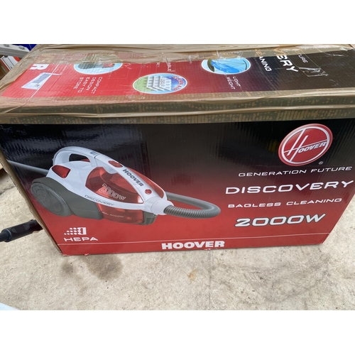 1392 - A HOOVER BAGLESS DISCOVERY VACUUM AND A BLACK AND DECKER HAND HELD VACUUM