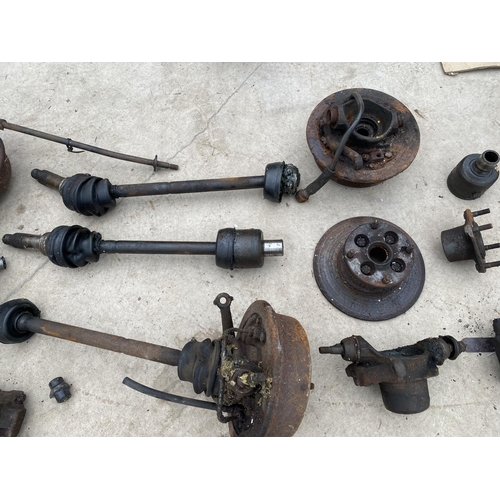 1407 - AN ASSORTMENT OF CAR PARTS TO INCLUDE DISCS AND SHAFTS ETC