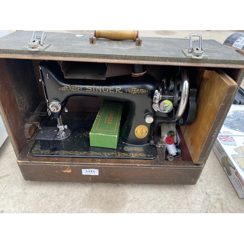 1411 - A VINTAGE SINGER SEWING MACHINE IN A CARRY CASE