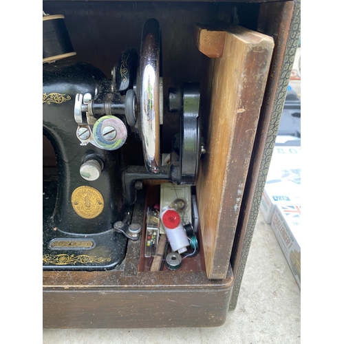 1411 - A VINTAGE SINGER SEWING MACHINE IN A CARRY CASE