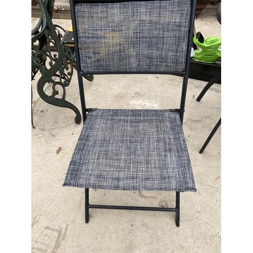 1443 - A METAL BISTRO TABLE WITH GLASS TOP AND TWO BISTRO CHAIRS