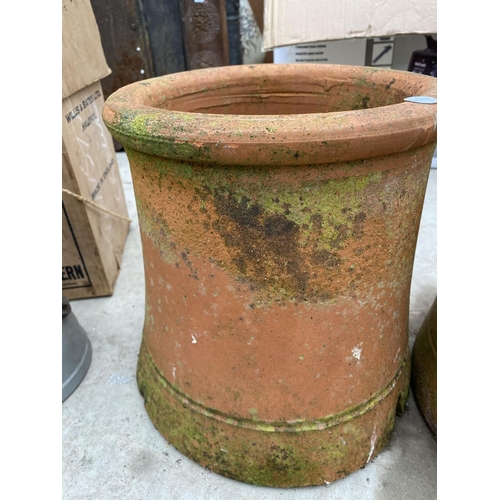 1450 - A PAIR OF ROUND CHIMNEY POT TOPS