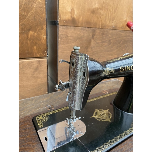 1477 - A VINTAGE SINGER SEWING MACHINE COMPLETE WITH CASE AND ORIGINAL FOOT PEDDLE AND INSTRUCTION MANUAL