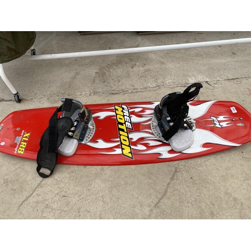 1494 - A FREE MOTION XLR8 SNOW BOARD WITH BINDINGS