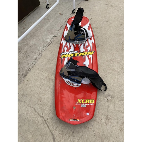 1494 - A FREE MOTION XLR8 SNOW BOARD WITH BINDINGS