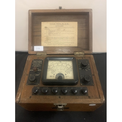 11A - A BOXED VINTAGE TAYLOR UNIVERSAL METER MODEL 83A TO INCLUDE INSTRUCTIONS AND AN INTEGRATED COMPARTME... 