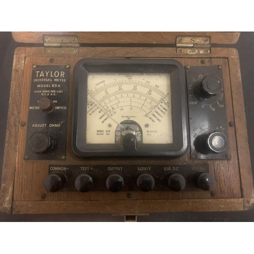 11A - A BOXED VINTAGE TAYLOR UNIVERSAL METER MODEL 83A TO INCLUDE INSTRUCTIONS AND AN INTEGRATED COMPARTME... 