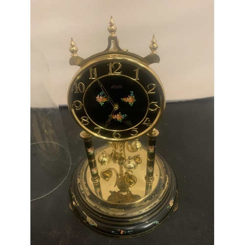 12 - A DECORATIVE MANTEL CLOCK WITH GLASS DOME H: 30CM