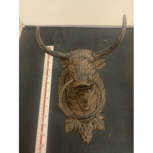 30 - A CAST METAL BULL'S HEAD WITH NOSE RING FOR WALL MOUNTING