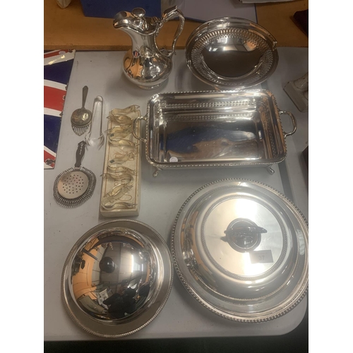 37 - A LARGE ASSORTMENT OF SILVER PLATE ITEMS TO INCLUDE A HEATED MUFFIN DISH, LEMON SQUEEZERS, A VEGETAB... 