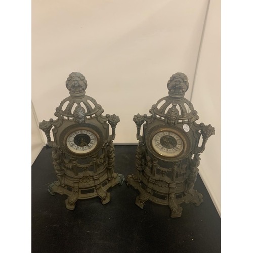 41 - A PAIR OF VINTAGE HOLLOW ORNATE SPELTER MANTEL CLOCKS