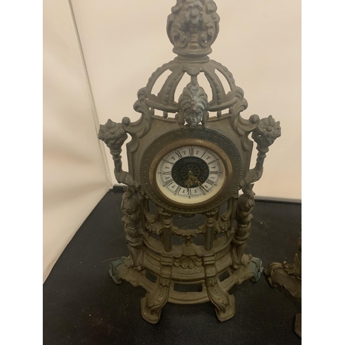 41 - A PAIR OF VINTAGE HOLLOW ORNATE SPELTER MANTEL CLOCKS