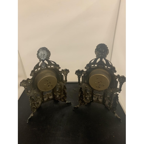 41 - A PAIR OF VINTAGE HOLLOW ORNATE SPELTER MANTEL CLOCKS