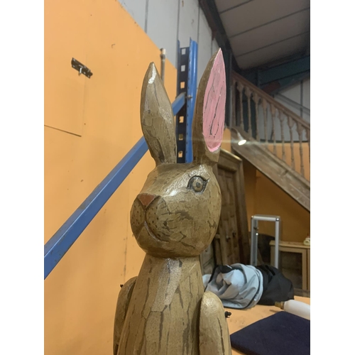 44 - A LARGE WOODEN SHELF RABBIT