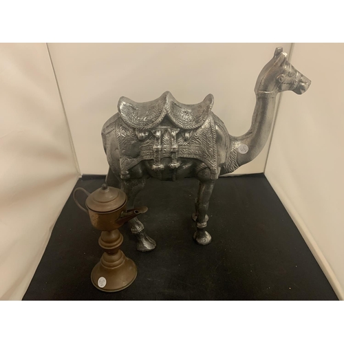 51 - A LARGE CAST METAL CAMEL AND A MIDDLE EASTERN STYLE COFFEE POT