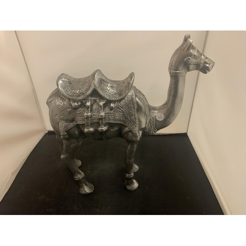 51 - A LARGE CAST METAL CAMEL AND A MIDDLE EASTERN STYLE COFFEE POT