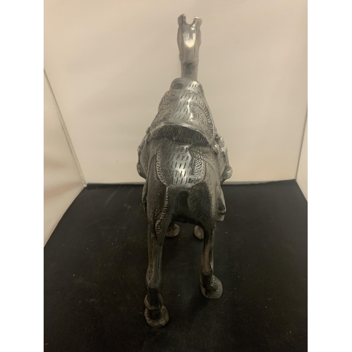 51 - A LARGE CAST METAL CAMEL AND A MIDDLE EASTERN STYLE COFFEE POT