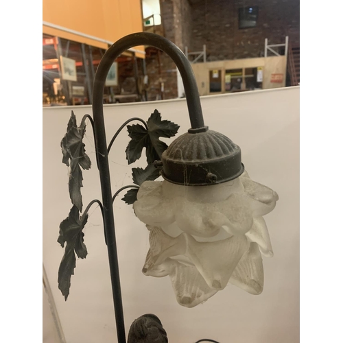 54 - A VINTAGE TABLE LAMP IN THE FORM OF A LADY TO INCLUDE A GLASS FLOWER SHADE AND FURTHER FLORAL DETAIL