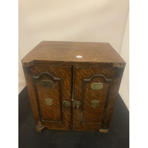 6 - A SMALL VINTAGE SMOKING COMPENDIUM IN THE FORM OF A WOODEN SAFE WITH BRASS DETAIL HEIGHT: 32CM (A/F)