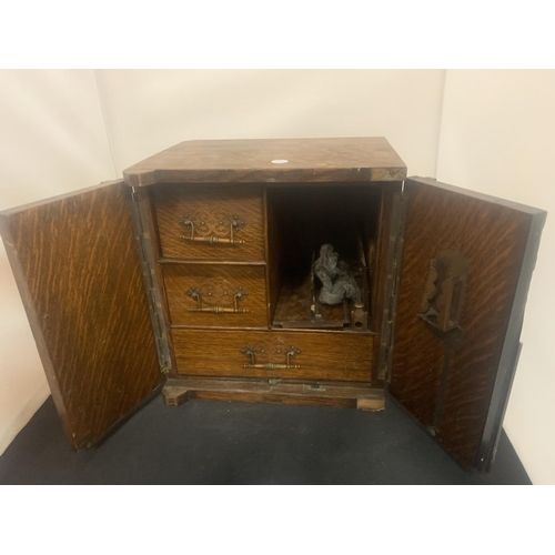 6 - A SMALL VINTAGE SMOKING COMPENDIUM IN THE FORM OF A WOODEN SAFE WITH BRASS DETAIL HEIGHT: 32CM (A/F)