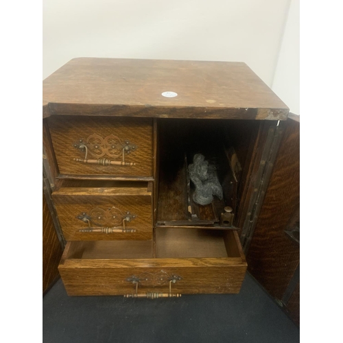 6 - A SMALL VINTAGE SMOKING COMPENDIUM IN THE FORM OF A WOODEN SAFE WITH BRASS DETAIL HEIGHT: 32CM (A/F)