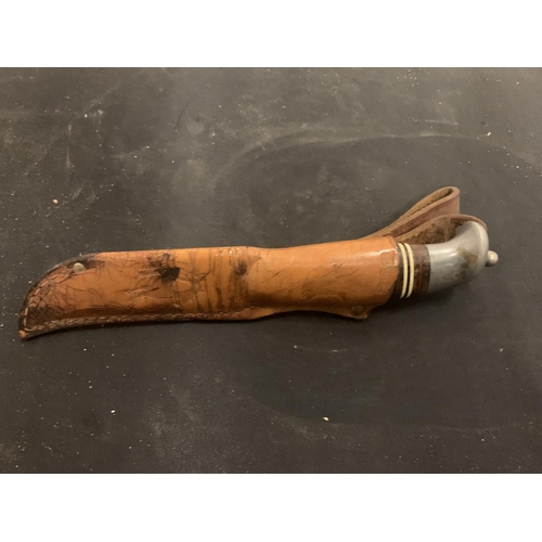 60 - A KNIFE WITH DECORATED HANDLE AND LEATHER SHEATH