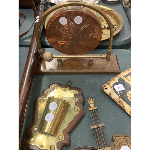 112 - A BRASS AND COPPER GONG, A BRASS WALL SPILL HOLDER, A COPPER WARMING PAN AND A PAIR OF CLOCK WEIGHTS