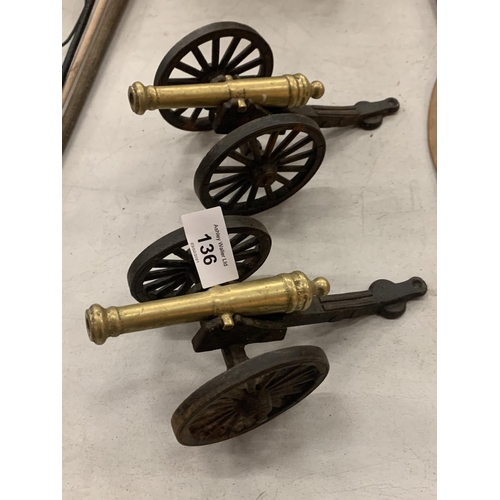 136 - A PAIR OF BRASS AND CAST IRON CANNONS