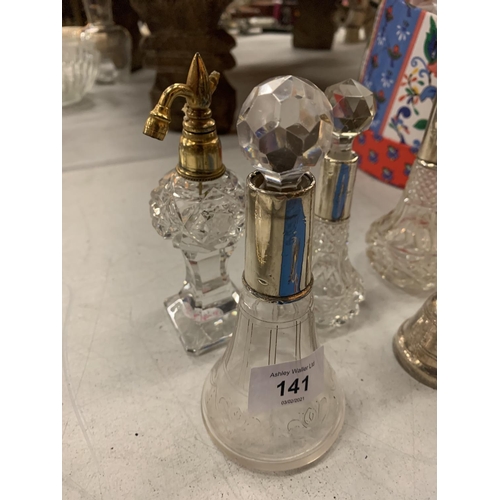 141 - A SILVER BELL INDISTINCT HALLMARK IN THE FORM OF A THISTLE AND FOUR GLASS PERFUME BOTTLES WITH HALLM... 