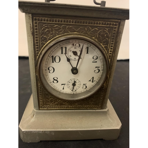 147 - A METAL CASED CARRIAGE CLOCK WITH BRASS DETAIL