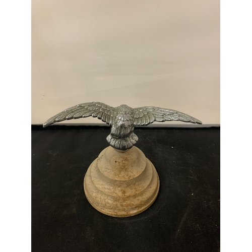 148 - A BIRD OF PREY ON A WOODEN BASE