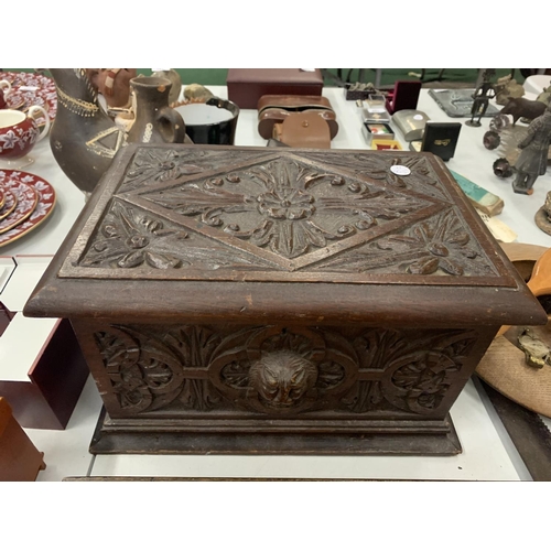 153 - A VINTAGE HEAVILY CARVED WOODEN BOX