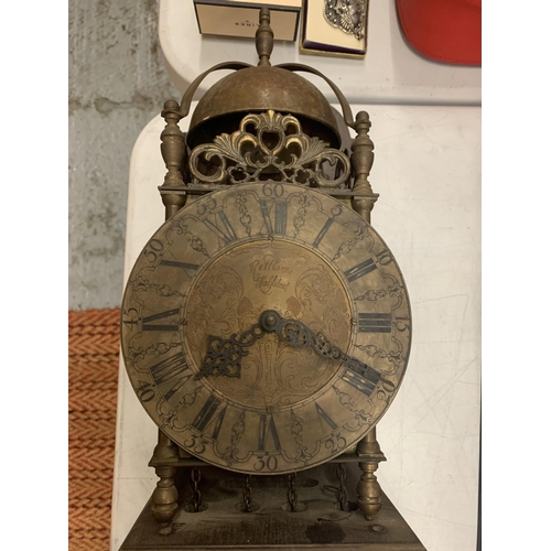 162 - A BRASS LANTERN CLOCK WITH WEIGHTS ON A WOODEN SUPPORT