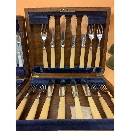 166 - TWO WOODEN BOXES OF SILVER PLATE FLATWARE TO INCLUDE A SET WITH PEARLESCENT HANDLES