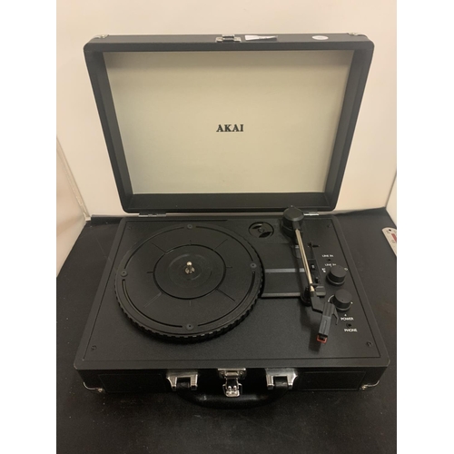 64 - AN AKAI PORTABLE TURNTABLE