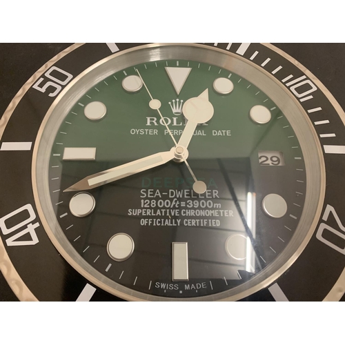 69 - A DEALERS WALL CLOCK DIAMETER: 34CM