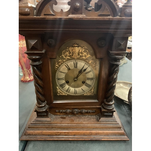 84 - A LARGE WOODEN MANTEL CLOCK (FINIALS A/F) APPROXIMATE HEIGHT 60CM