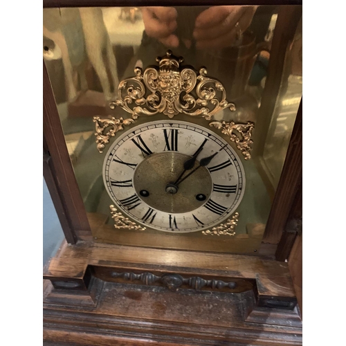 84 - A LARGE WOODEN MANTEL CLOCK (FINIALS A/F) APPROXIMATE HEIGHT 60CM