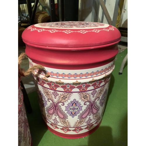 415 - A SET OF THREE GRADUATED PINK PAISLEY LEATHER EFFECT LIDDED STORAGE STOOLS