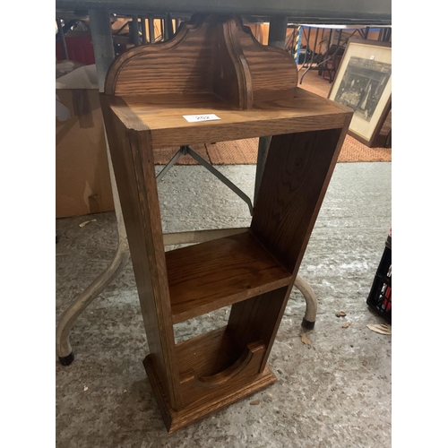 252 - A WOODEN WALL HANGING SHELF UNIT