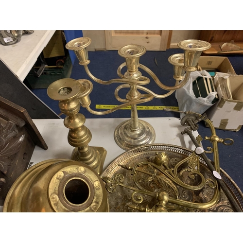 277 - A LARGE QUANTITY OF SILVER PLATE AND BRASS TO INCLUDE TRAYS, CANDLEABRA, HORSESHOE, BELLS ETC