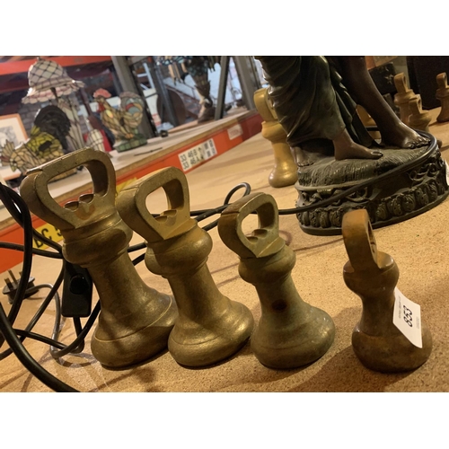 853 - FOUR VARIOUS SIZED VINTAGE BRASS WEIGHTS