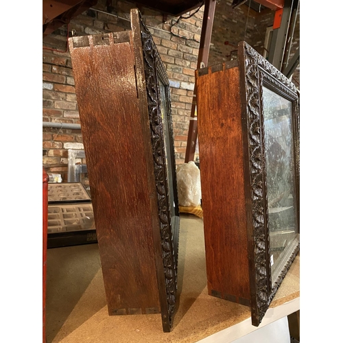 804 - A PAIR OF HEAVILY CARVED OAK AND MAHOGANY GLASS FRONTED WALL CUPBOARDS (ONE GLASS DOOR A/F) - HEIGHT... 