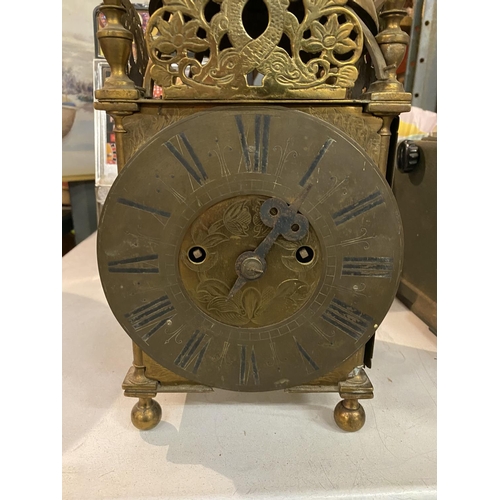 838 - A BRASS LANTERN CLOCK