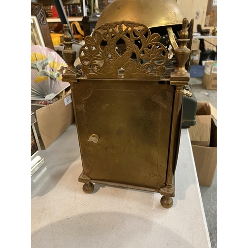 838 - A BRASS LANTERN CLOCK