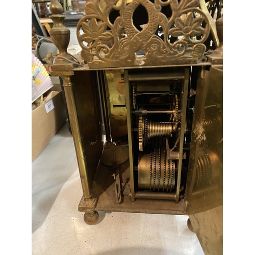 838 - A BRASS LANTERN CLOCK