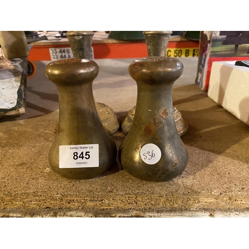 845 - A PAIR OF BRASS CANDLESTICKS AND A PAIR OF BRASS WEIGHTS