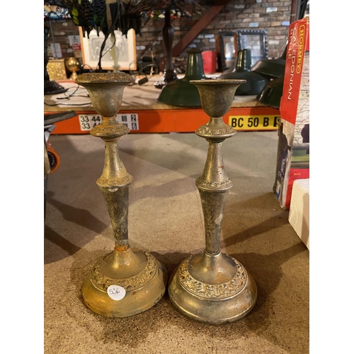 845 - A PAIR OF BRASS CANDLESTICKS AND A PAIR OF BRASS WEIGHTS