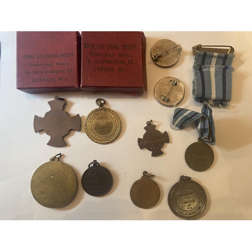 380 - ELEVEN VARIOUS MEDALS FOR SWIMMING AND LIFE SAVING ETC DATED BACK TO 1945